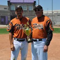 Two Tribe Team Members Holding a Trophy