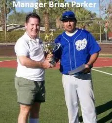 Manager Brian Parker on the Field With a Trophy