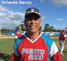 Orlando Garcia in a Red Color Top Smiling
