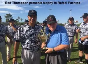 Red Thompson Presents Trophy to Rafael Fuentes
