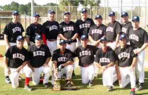 NJ Reds in Black Uniform With Trophy