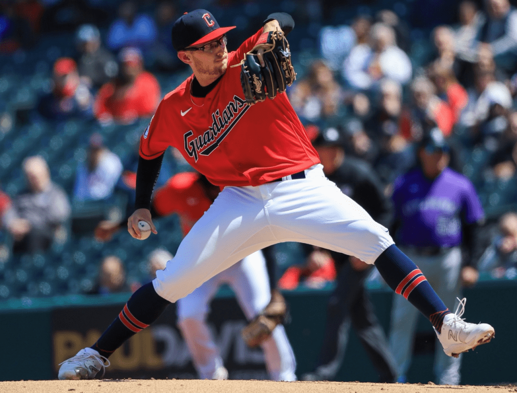 A baseball player is pitching a ball during a game.