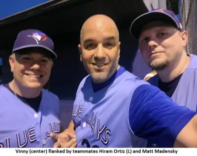 Three baseball players posing for a selfie.
