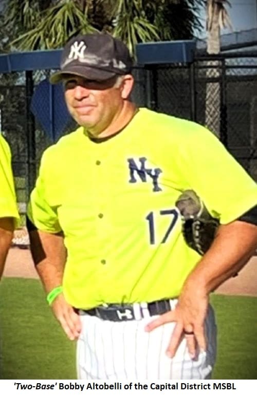 Baseball player in NY jersey and cap.