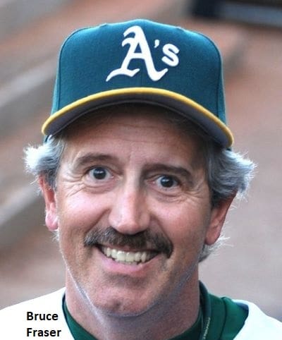 Middle-aged man with a mustache, wearing an oakland athletics baseball cap, smiling at the camera.