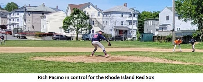 Baseball player pitching on a field.