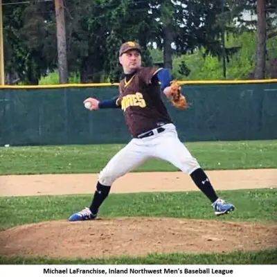 Baseball pitcher throwing on the mound.