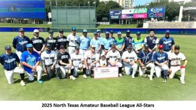 Baseball team posing on field, group photo.
