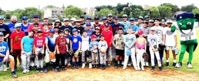 Group photo of baseball players and mascot.
