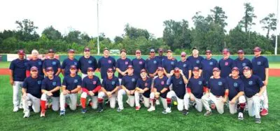 Baseball team posing on a field.