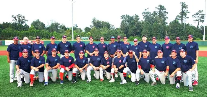 Baseball team posing on a field.